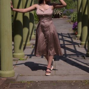 This is a size 8 Eva• Mendes light brown/ tan w/white Polka Dots & pink flowers.